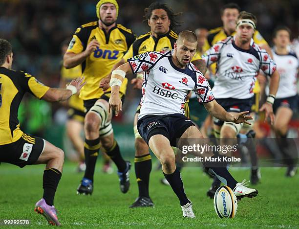 Drew Mitchell of the Waratahs kicks ahead leading to a try during the round 14 Super 14 match between the Waratahs and the Hurricanes at Sydney...