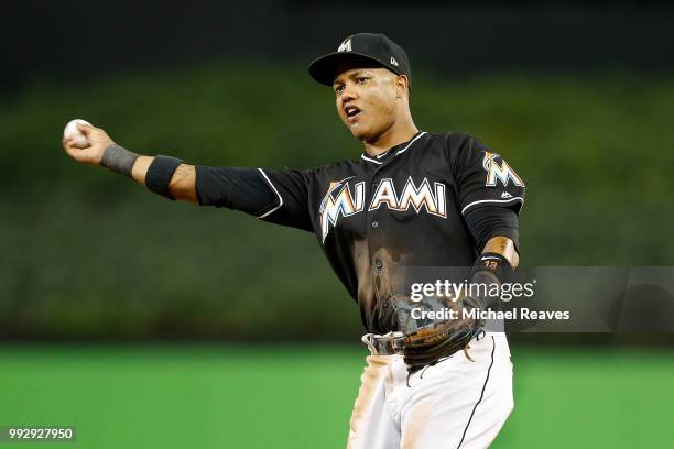 Starlin Castro of the Miami Marlins throws out a runner at first base against the New York Mets at Marlins Park on June 29, 2018 in Miami, Florida.