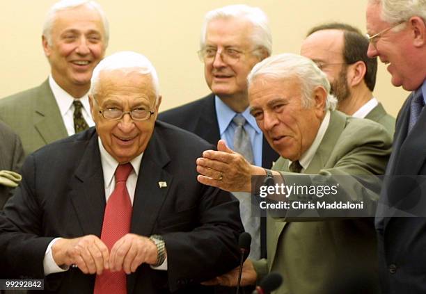 Israeli Prime Minister Ariel Sharon with Rep. Benjamin Gilman, R-NY, after signing the visitor's logbook at the Capitol.