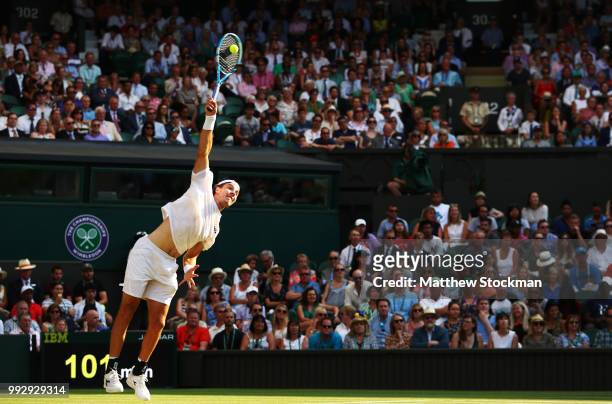 Jan-Lennard Struff of Germany serves against Roger Federer of Switzerland during their Men's Singles third round match on day five of the Wimbledon...