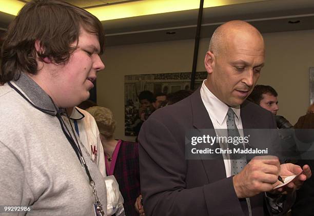 Elliot Wolf from Takoma Park, Md., waits for an autograph from former baseball player Cal Ripkin. Both Ripkin and Rep. Tom Davis, R-Va., spoke at an...