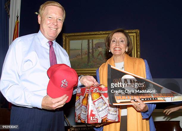 Rep. Nancy Pelosi, D-CA, collects her winnings from a bet with Rep. Dick Gephardt, D-MO. The two bet on their baseball teams - the St. Louis...