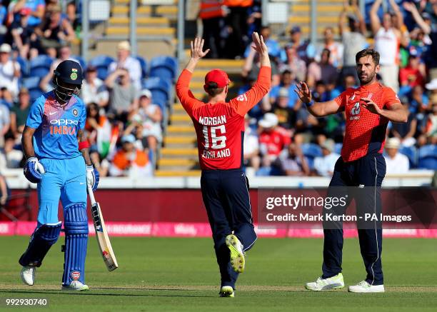 England's Liam Plunkett celebrates taking the wicket of India's KL Rahul with captain Eoin Morgan during the Vitality IT20 Series Match at The SSE...