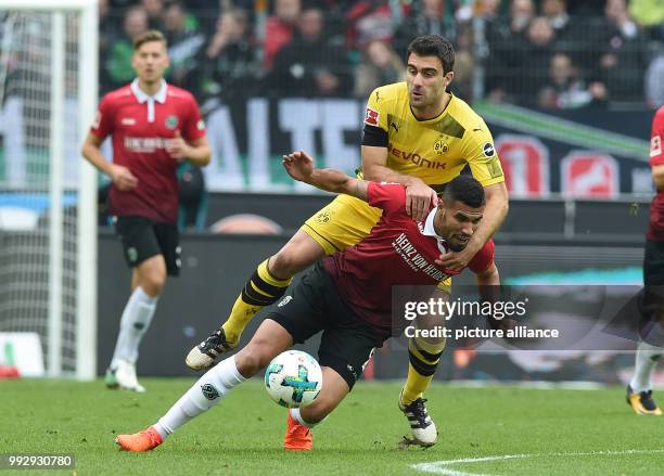 Dortmund's Sokratis and Hanover's Jonathas Cristian vie for the ball during the Bundesliga soccer match between Hertha BSC and Hamburger SV in the...