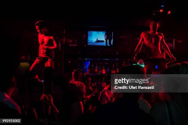 Dancers performs Go-Go dance in Mixwell bar on July 4, 2018 in Seminyak, Bali, Indonesia. For the past 12 years Mixwell bar has been described as...