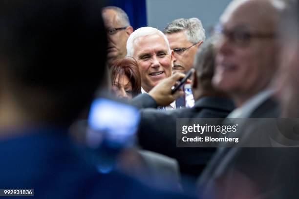 Vice President Mike Pence greets employees at the U.S. Immigration and Customs Enforcement agency headquarters in Washington, D.C., U.S., on Friday,...