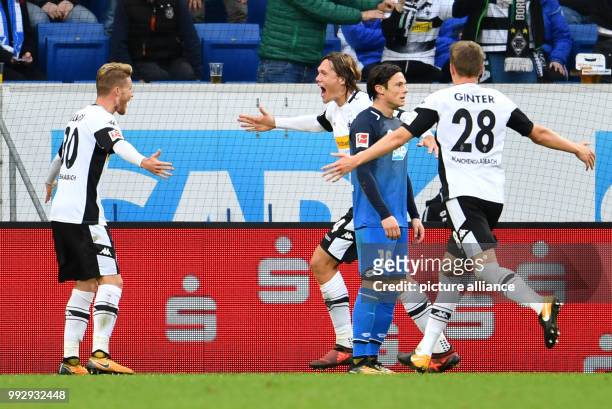 Gladbach's Jannik Vestergaard celebrates after his goal for 1:3 with Nico Elvedi and Matthias Ginter during the Bundesliga soccer match between 1899...
