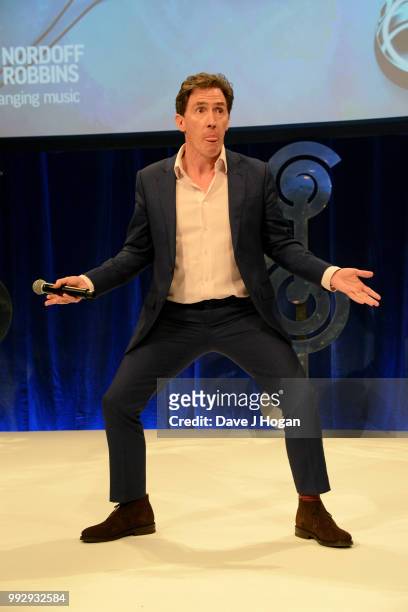 Presenter Rob Brydon on stage during the Nordoff Robbins' O2 Silver Clef Awards ceremony at Grosvenor House, on July 6, 2018 in London, England.