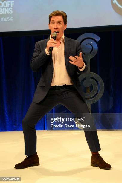 Presenter Rob Brydon on stage during the Nordoff Robbins' O2 Silver Clef Awards ceremony at Grosvenor House, on July 6, 2018 in London, England.