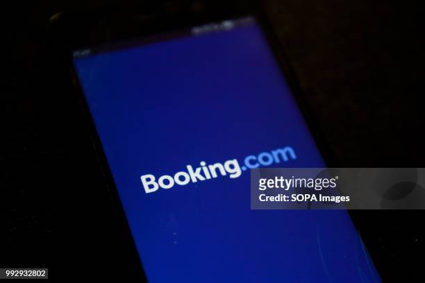 Booking.com app is seen on a mabile phone.