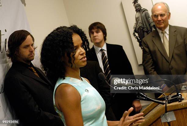 Jars of Clay band members Matt Bronleewe and Dan Haseltine, and Sen. Larry Craig, R-Id., watch Victoria Rowell, actor on the Young and the Restless,...