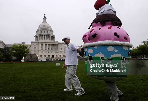 Jose Cerda, with Ben and Jerry's Ice Cream, at protest against the oil drilling of ANWR by presenting a giant "Baked Alaska" on West Front lawn of...