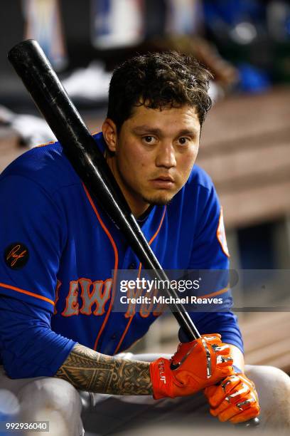 Wilmer Flores of the New York Mets looks on in the dugout against the Miami Marlins at Marlins Park on June 29, 2018 in Miami, Florida.