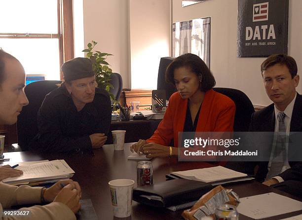 Singer and activist Bono at the offices of DATA, a group devoted to fighting African debt and AIDS. Sitting with him are Jamie Drummond, director,...