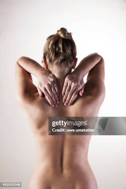 bare back of a young woman - bare back stock-fotos und bilder