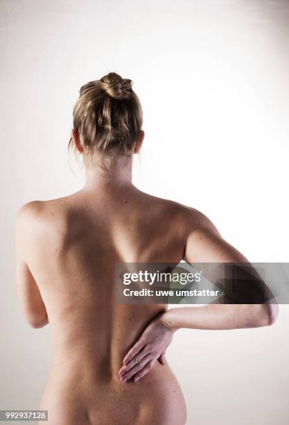 bare back of a young woman - bare back stock-fotos und bilder