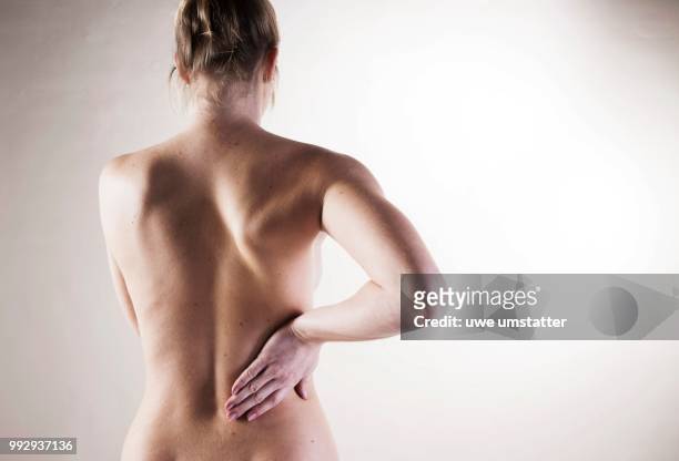 bare back of a young woman - intervertebral discs stock pictures, royalty-free photos & images