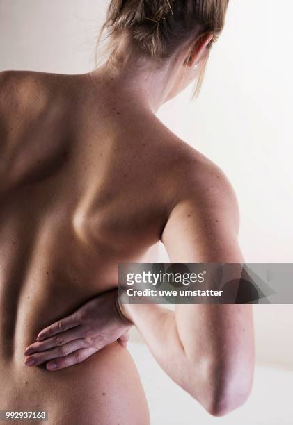 bare back of a young woman - bare back stock-fotos und bilder