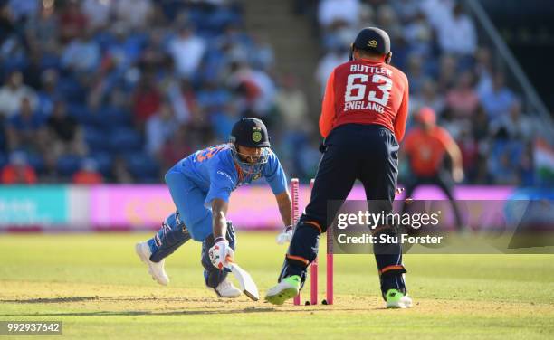 India batsman Suresh Raina is stumped by Jos Buttler during the 2nd Vitality T20 International between England and India at Sophia Gardens on July 6,...