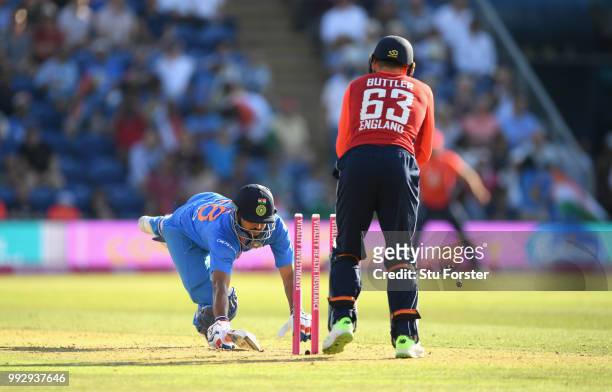 India batsman Suresh Raina is stumped by Jos Buttler during the 2nd Vitality T20 International between England and India at Sophia Gardens on July 6,...