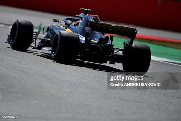 Renault's Spanish driver Carlos Sainz Jr drives during the second practice session at Silverstone motor racing circuit in Silverstone, central...