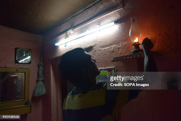 Man seen demonstrating how they used to live with the Oil lamp. After 70 years of Independence power supply has finally reached Elephanta Caves near...