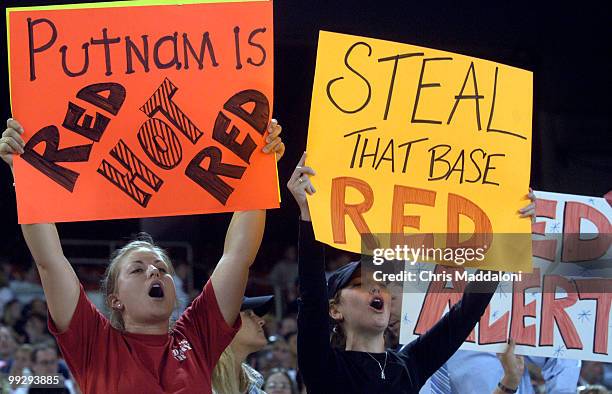 Rachel Volinski and Kristene Henkelman, with Rep. Putnam, cheer the GOP at the 44th Annual Congressional Baseball Game at RFK stadium.