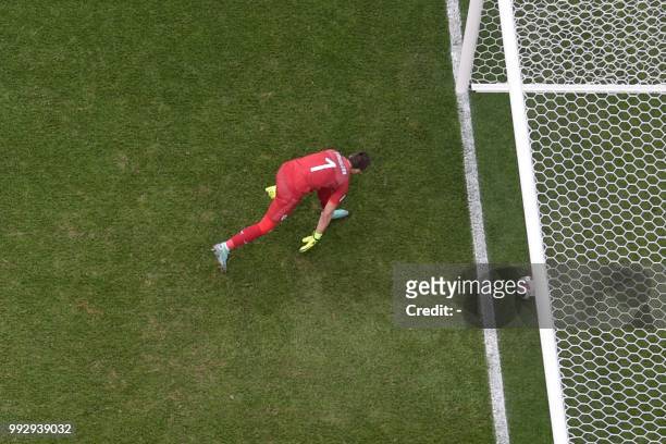 Uruguay's goalkeeper Fernando Muslera deflects the ball into his net during the Russia 2018 World Cup quarter-final football match between Uruguay...