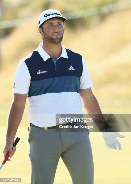 Jon Rahm of Spain plays his second shot into the 18th green during the second round of the Dubai Duty Free Irish Open at Ballyliffin Golf Club on...