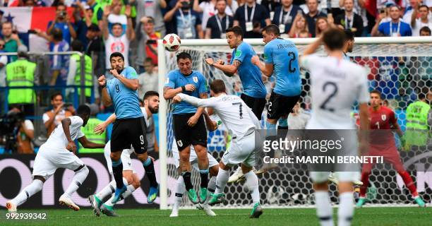 Uruguay's forward Luis Suarez, Uruguay's midfielder Cristian Rodriguez, Uruguay's midfielder Matias Vecino and Uruguay's defender Jose Gimenez jump...