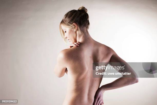 bare back of a young woman - intervertebral discs stock pictures, royalty-free photos & images