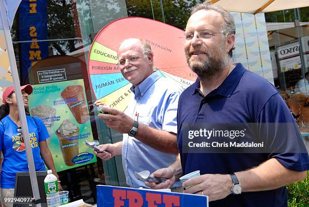 Co-founders of Ben and Jerry's Ice Cream, Ben Cohen and Jerry Greenfield, scoop "American Pie" ice cream at the Eastern Market location to promote...