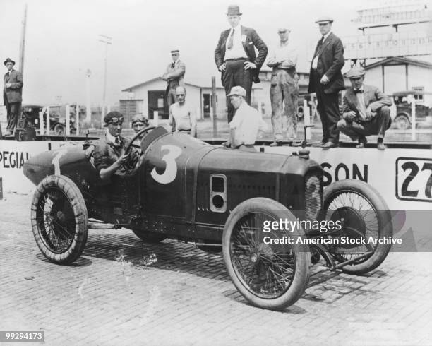 Driver and his riding mechanic in their car at the Indianapolis 500, Indianapolis Motor Speedway in Speedway, Indiana, circa 1920.
