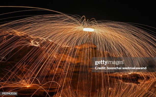 steel wool on beach, fire dance show - burning steel wool firework stock pictures, royalty-free photos & images