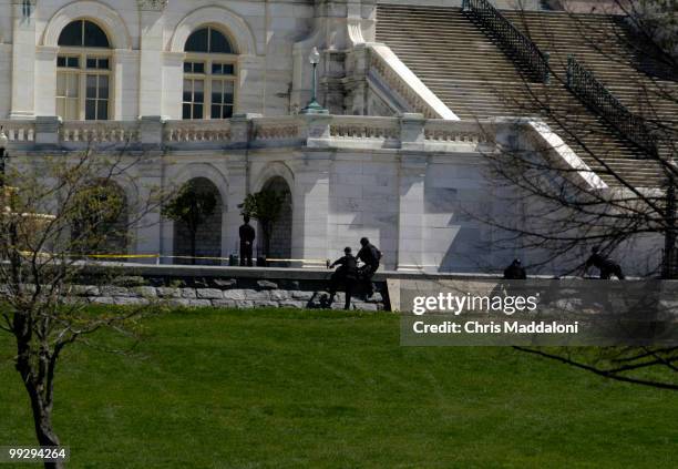 Capitol Police swat team members respond to a man with two suspicious packages on the West Front of the Capitol.