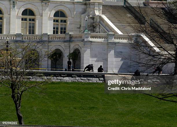 Capitol Police swat team members respond to a man with two suspicious packages on the West Front of the Capitol.