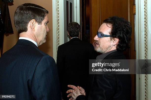 Singer and activist Bono talks with Sen. Bill Frist, R-Tn., in the Capitol. Bono was on the Hill to talk about AIDS.