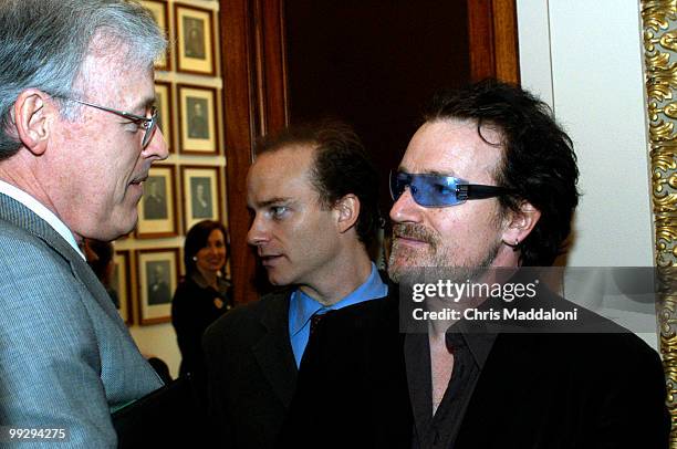 Singer and activist Bono talking with Allen Moore, Sen. Bill Frist's Legislative Director, in the Capitol. Bono was on the Hill to talk about AIDS.