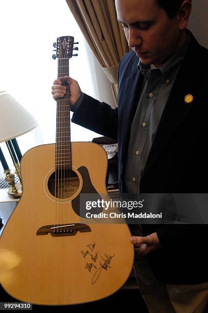 Rep. Ban Boren, D-Ok., at his office, with a guitar signed by Toby Keith.