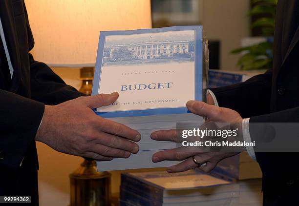 Rep. Jo Bonner, R-Al., and Riche Meade, Chief of Staff for the House Budget Committee, receive copies of the FY 2004 budget.