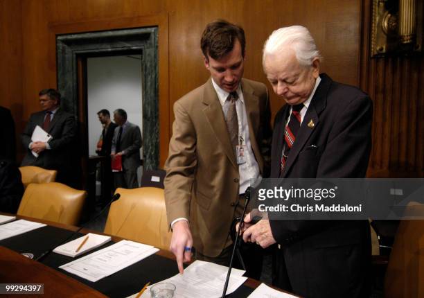 Sen. Robert Byrd, D-WV. Speaks to an aide before an Senate Armed Services Committee Defense Authorization hearing on the FY2007 Defense Department...