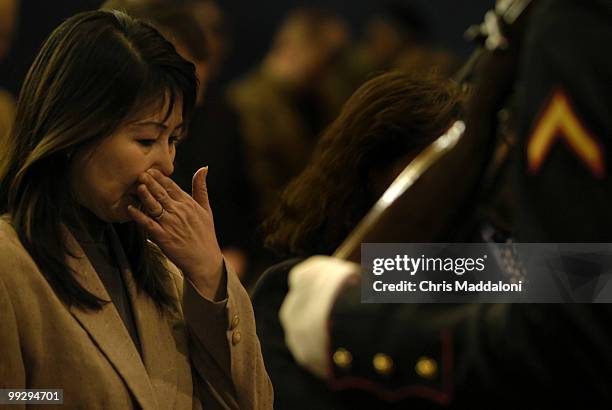 The mother of Corporal Binh Le, Kim Hoan Thi Nguyen, during a ceremony for Le's posthumous U.S. Citizenship at the Navy Annex in Arlington, Va. Le, a...