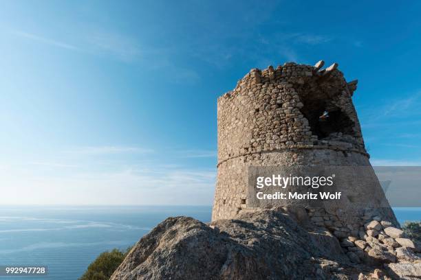 half-ruined stone tower, genoese tower, corsica, france - genoese stock pictures, royalty-free photos & images