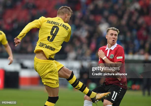 Dortmunds Andrij Jarmolenko shoots the 2:2 goal next to Hanover's Felix Klaus during the Bundesliga soccer match between Hanover 96 and Borussia...