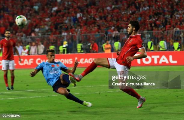 Players fight for the ball during the Confederation of African Football Champions League final first leg soccer match between Al-Ahly SC and Wydad AC...
