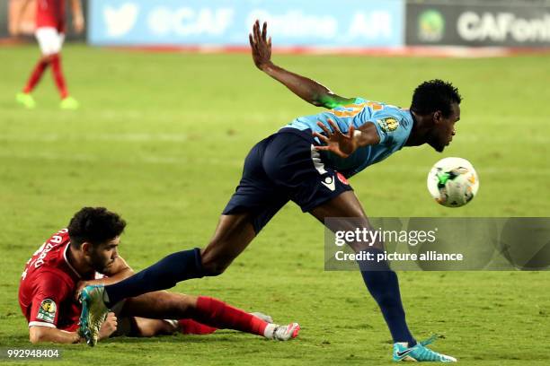 Players fight for the ball during the Confederation of African Football Champions League final first leg soccer match between Al-Ahly SC and Wydad AC...