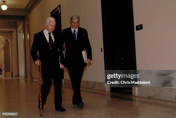 Sen. Robert Byrd, D-WV, is helped by Sen. John Warner, R-Va., into a meeting meeting at Sen. John McCain's office about a compromise deal being...