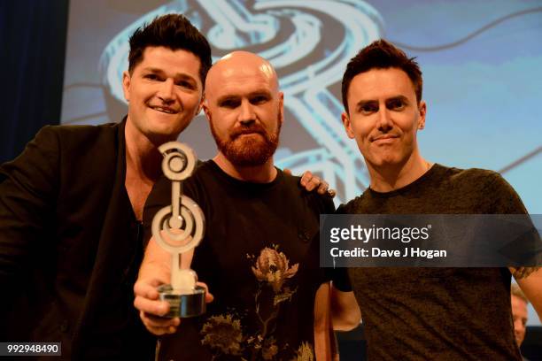 Danny O'Donoghue, Mark Sheehan and Glen Power of The Script, winners of the Raymond Weil International Award on stage during the Nordoff Robbins' O2...