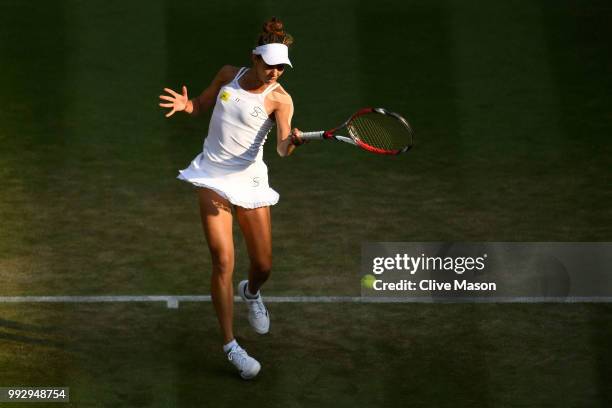 Mihaela Buzarnescu of Romania returns a shot against Karolina Pliskova of Czech Republic during their Ladies' Singles third round match on day five...