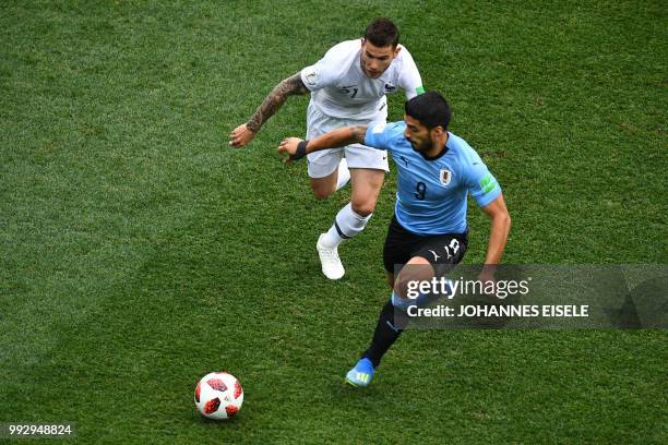 Uruguay's forward Luis Suarez vies for the ball with France's defender Lucas Hernandez during the Russia 2018 World Cup quarter-final football match...